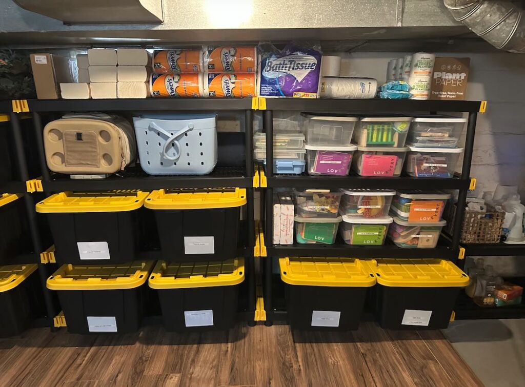 Shelving in a New Jersey basement organized with labeled storage bins, household supplies, and neatly sorted containers, reflecting the detailed systems OCD Organized brings to homes across Monmouth and Ocean County.